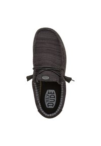 Schwarzer gestrickter Slipper mit runder Spitze, elastischen Schnürsenkeln und einem strukturierten Obermaterial. Verfügt über eine gepolsterte Innensohle und eine Gummisohle.