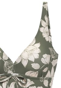 Zelený kvetinový bikiny top s trojuholníkovými pohárikmi, s bielej kvetinovej vzorom, nastaviteľnými popruhmi a zaväzovaním v prednej časti.