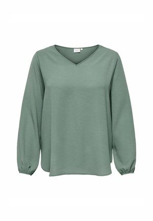 Groene langetermijn-sweater met lange mouwen, gemaakt van gestructureerde stof met een V-hals en gegatherde manchetten. Het heeft een comfortabele pasvorm en subtiele details in het materiaal.