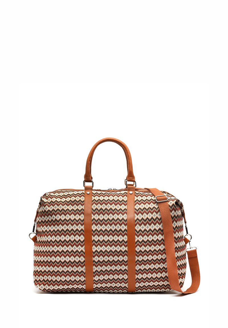 Woven textile duffel bag with a zigzag pattern in cream, brown, and rust, featuring brown leather handles and a removable shoulder strap.