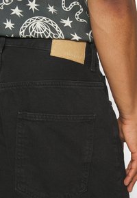 YOURTURN Vaqueros baggy - black denim