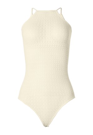 Maillot de bain une pièce couleur crème avec un motif texturé en crochet et fines bretelles doubles.