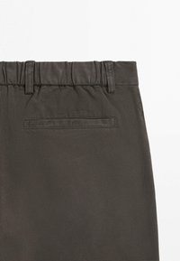 Dark gray elastic waistband pants with belt loops and a single back welt pocket shown against a white background.