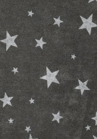 Gray textured fabric featuring scattered white stars in various sizes, creating a simple and contrasting pattern.