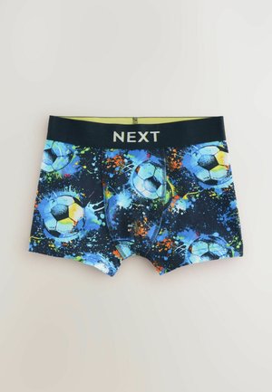 Shorts de boxeur avec un motif de ballon de football bleu et noir agrémenté d'éclaboussures orange et vert. Taille élastique marquée "NEXT." Matière en coton.