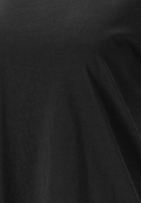 Black cotton t-shirt with a smooth texture, loose fit, and slightly draped design. No visible patterns or hardware details.