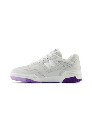 White athletic shoe with synthetic leather upper, lavender accents, and textured rubber sole. Features padded collar and lace-up design.