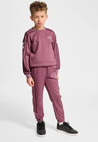Purple athletic tracksuit featuring a long-sleeve top with ribbed cuffs, matching pants with elastic ankles, and contrasting black side stripes.