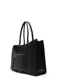 Black leather tote bag with a textured finish, featuring two long handles, a front zippered pocket, and gold hardware accents.