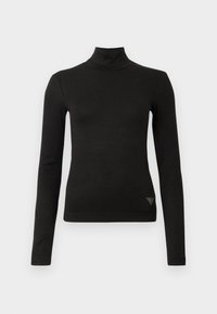 Maglia nera a maniche lunghe, aderente, con colletto a dolcevita e un piccolo logo triangolare vicino all'orlo in basso sul lato destro anteriore.