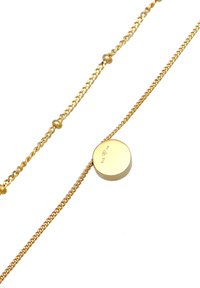 Guld-tonet halskæde med en delikat kæde og små perler samt en glat, rund vedhæng mærket med "925" og et diaman symbol.