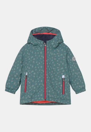 Veste à capuche en bleu sarcelle avec un motif à pois. Comprend des zips roses, des poignets élastiques et une doublure intérieure d'une couleur contrastante.