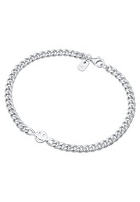 Silverfärgad kedjebracelet med ett smiley-ansikte charm, krabbklämma och en tagg, med en enhetlig glänsande yta och sammanlänkade länkar.