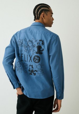 Blue long-sleeve shirt featuring black cartoon graphics of Felix the Cat on the back. Made from a smooth fabric with a button-down design.