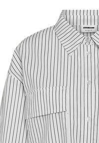 White button-up shirt featuring black vertical stripes, a classic collar, and a chest pocket with a relaxed fit design.