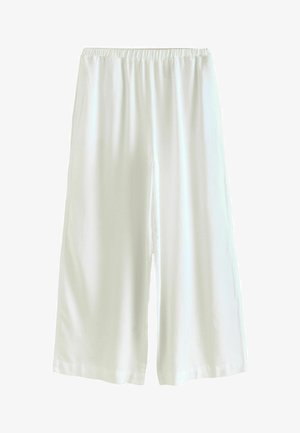 Pantalones anchos blancos con una cintura elástica, hechos de un tejido suave, que presentan un corte holgado y sin bolsillos ni patrones visibles.