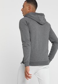 Under Armour RIVAL  - Veste de survêtement - charcoal light heather/black