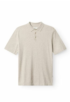 Svetlobéžové polokošeľa vyrobená z mäkkej látky, s golierom, troj- gombíkovou légou a krátkymi rukávmi. Jednoduchý dizajn bez vzorov.