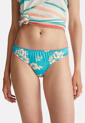 Tyrkysové spodní díly bikiny s květinovým vzorem v broskvové barvě, se zvlněným růžovým lemem. Materiál vypadá hladce a má nařasený pas.