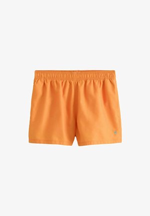 Orange elastiske badeshorts med lille blåt palmetræslogo på venstre nederste ben og sidelommer.