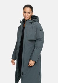 Grey long coat with a hood, featuring a zip and button closure, front pocket, and soft texture. Suitable for cold weather.