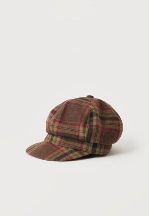 Brown and red plaid flat cap with a short brim, shown from the side on a plain light background.