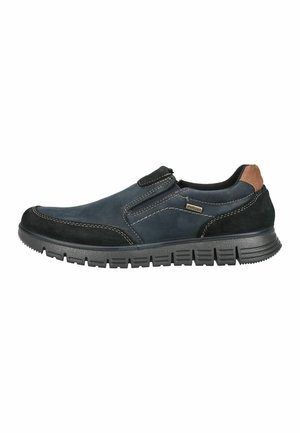 Legerlicher Herrenschuh zum Hineinschlüpfen aus marineblauem und schwarzem Wildleder mit braunem Fersendetail und dicker schwarzer Gummisohle mit Profil.