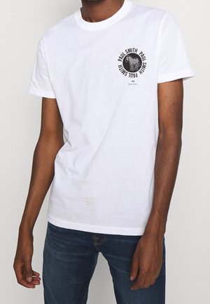 White cotton t-shirt with a round neckline, featuring a black zebra graphic and text on the left chest area. Soft texture, classic fit.