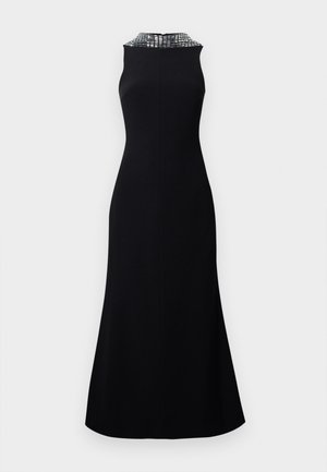 Robe noire sans manches avec un corsage ajusté et une jupe évasée. L'encolure est ornée d'un motif texturé en argent.