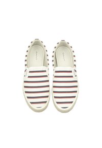 Canvas slip-on shoes with navy, white, and red horizontal stripes. White rubber soles with textured edges. Brand name "GANT" inside.