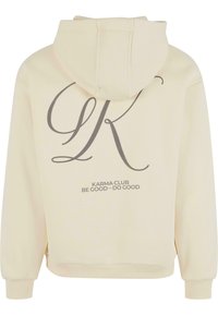 Cremefarvet hoodie med en blød tekstur, der har et stort gråt logo og tekst på ryggen. Inkluderer hætte og ribbede manchetter.