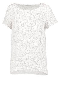 Haut blanc à manches courtes avec un motif géométrique noir de fines lignes. Encolure ronde et coupe décontractée, fabriqué à partir d'un tissu léger.