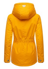 Yellow waterproof jacket featuring a cinched waist, hood, and snap button closures on sleeves. Smooth texture with minimalist design details.