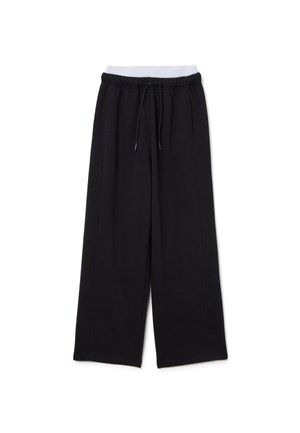 Schwarze weit geschnittene Sweatpants mit elastischem Bund, Kordelzug, Seitennähten und weichem Stoff. Geeignet für legere Kleidung.