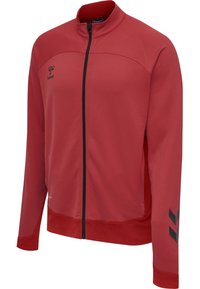 Czerwona sportowa kurtka na pełny zamek błyskawiczny z czarnym zamkiem, czarne logo Chevron na lewym rękawie oraz logo hummel na prawym boku klatki piersiowej.