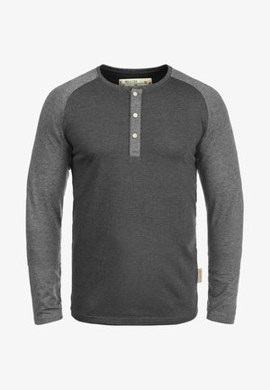 Long-sleeve henley shirt in dark gray, featuring contrasting light gray raglan sleeves, three-button placket, and woven label detail.