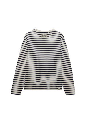 Biała koszula z długim rękawem i granatowymi poziomymi paskami, z okrągłym dekoltem oraz metką marki wewnątrz kołnierzyka i przy dolnym brzegu.