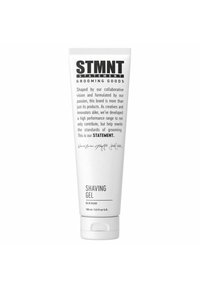 White tube of STMTN Shaving Gel, 150 ml. Features bold black text, smooth tube design, and a flip-top cap for easy dispensing.