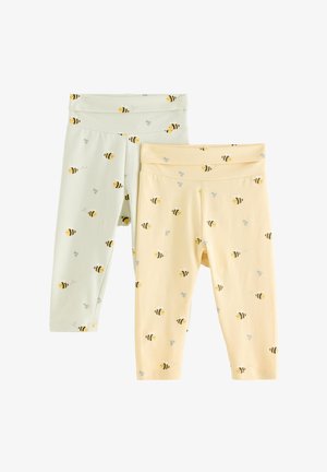 Kaks paari retuuse, üks heledalt roheline ja üks pehmelt kollane, mõlemad mesilase ja lille mustriga, valmistatud pehmest puuvillasegust kangast.