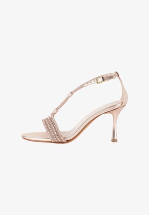 Sandalo con tacco alto in oro rosa con cinturino alla caviglia, chiusura con fibbia e cinturini decorativi con strass sopra le dita e il piede.