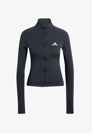 Chaqueta deportiva negra con mangas largas, cuello alto y cremallera frontal. Presenta un tejido texturizado y un logotipo blanco en la parte superior izquierda del pecho.