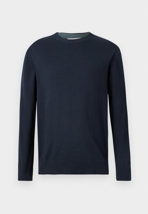 Maglione girocollo blu navy con maniche lunghe e polsini e orlo a costine, esposto su uno sfondo chiaro e semplice.