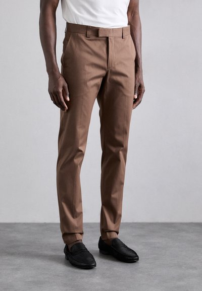 Brown tailored trousers made from lightweight fabric with a smooth texture, featuring a straight cut and subtle crease details.