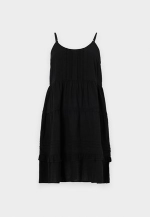 Vestido negro sin mangas con tirantes finos, diseño en capas, cuerpo texturizado y dobladillo con volantes. Hecho de tela ligera.