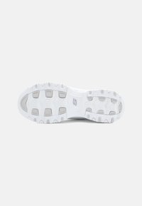 White athletic shoe outsole featuring textured rubber, patterned tread for traction, and subtle grey accents in the midsole design.