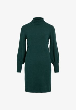 Vestido de punto en verde profundo con cuello alto. Presenta mangas largas abullonadas y puños de canalé. Textura suave, diseño hasta la rodilla.