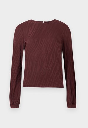 Burgundy long-sleeve top with a subtle wave-pattern texture, round neckline, and gathered wrists. Back closure detail visible.