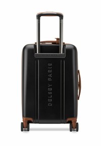 Valigia rigida nera con finitura testurizzata, dettagli marroni, manico estraibile e quattro ruote per la mobilità. Logo "Delsey Paris" visibile.