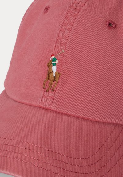 Red baseball cap with embroidered logo of a polo player in green and white riding a brown horse holding a mallet.