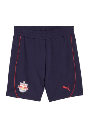 Marineblauwe sportshorts met rode zijkanten, elastische tailleband, voorzakken en bedrukt logo van Red Bull Salzburg. Gemaakt van zacht materiaal.